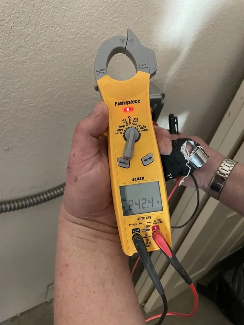 Voltage testing with clamp meter during Outlet Installation in Orland Park